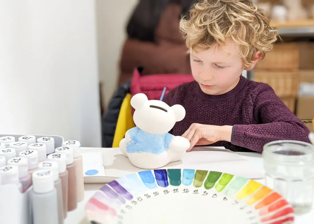 boy painting at The Potty Sheep